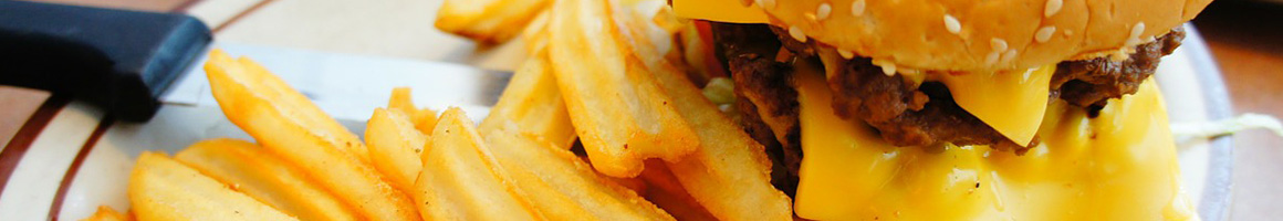 Eating Burger Fast Food at Mr Hamburger restaurant in Huntsville, TX.